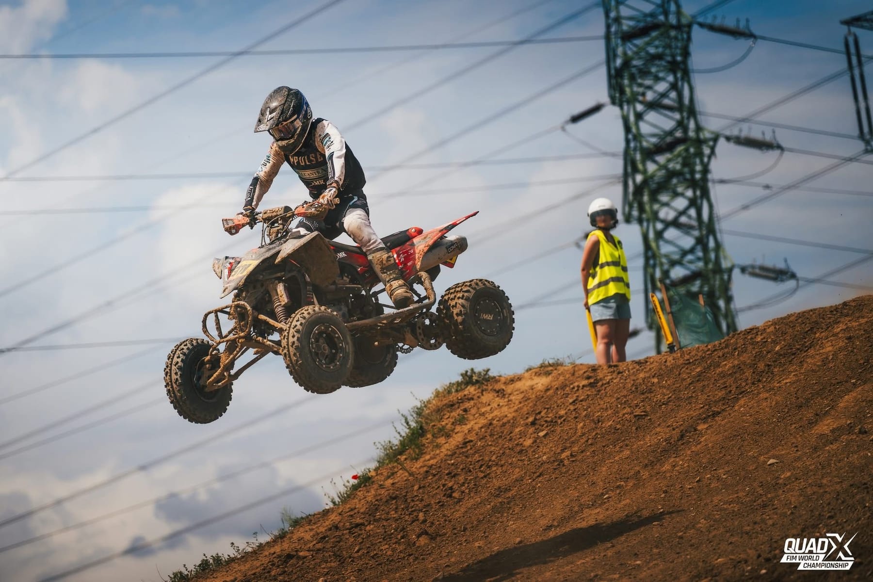 Kevin Saar airborne on his quad, RWI lettering on the rear wheel